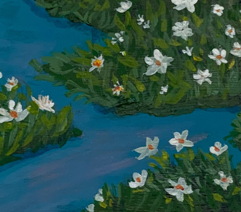 blue waters, green lush plants, white flowers