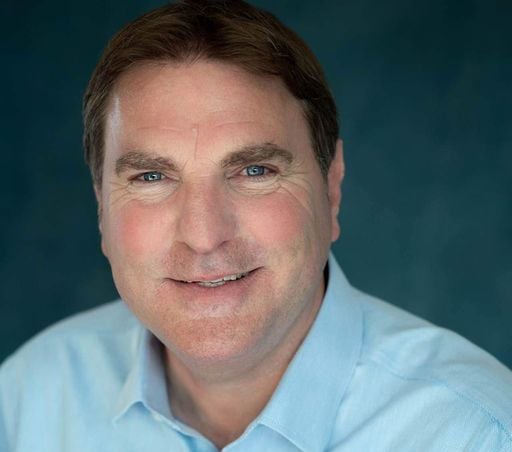 a man in a blue shirt and a blue shirt