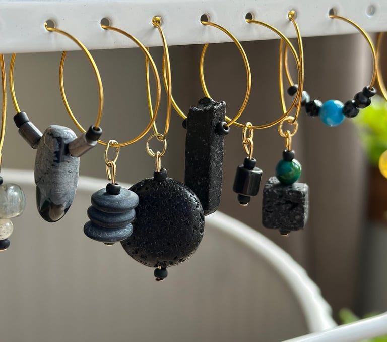 Rosevale Accessories handmade gemstone wine charms on jewelry display