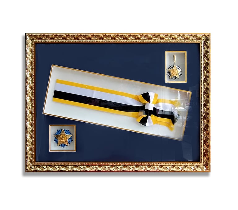 The perfect shadow box frame showcasing medals and a ribbon.