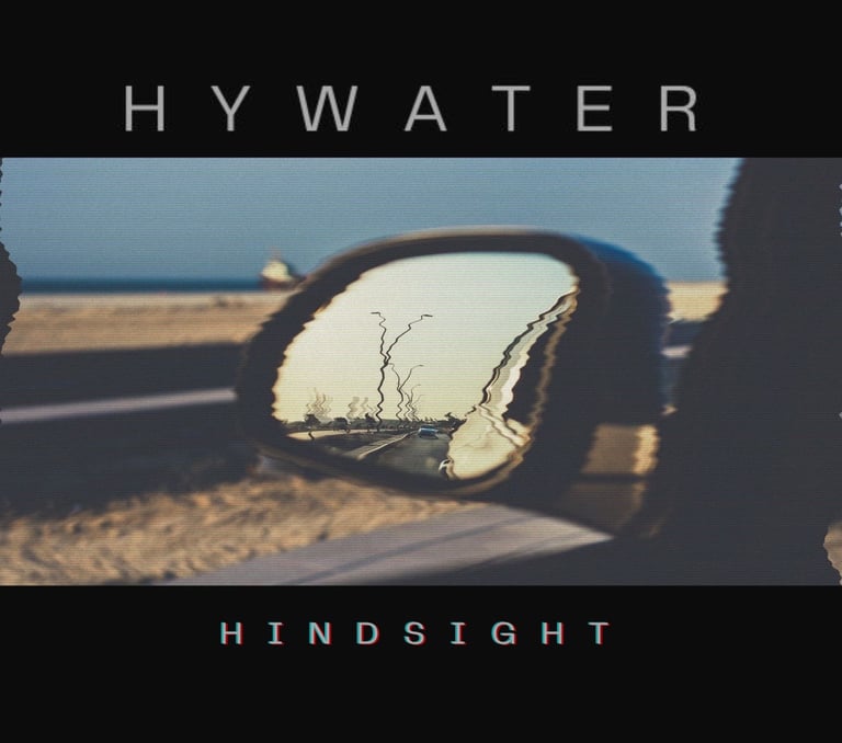 Hindsight single cover. A car mirror with a reflection of a tree in the background