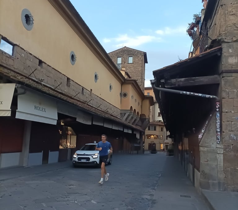 A lone jogger crossed the Ponte Vecchio