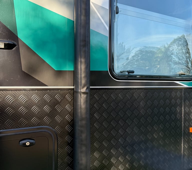 Durable awning arm covers protecting caravan hardware from road grime