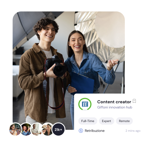 a man and woman taking a selfie with a camera