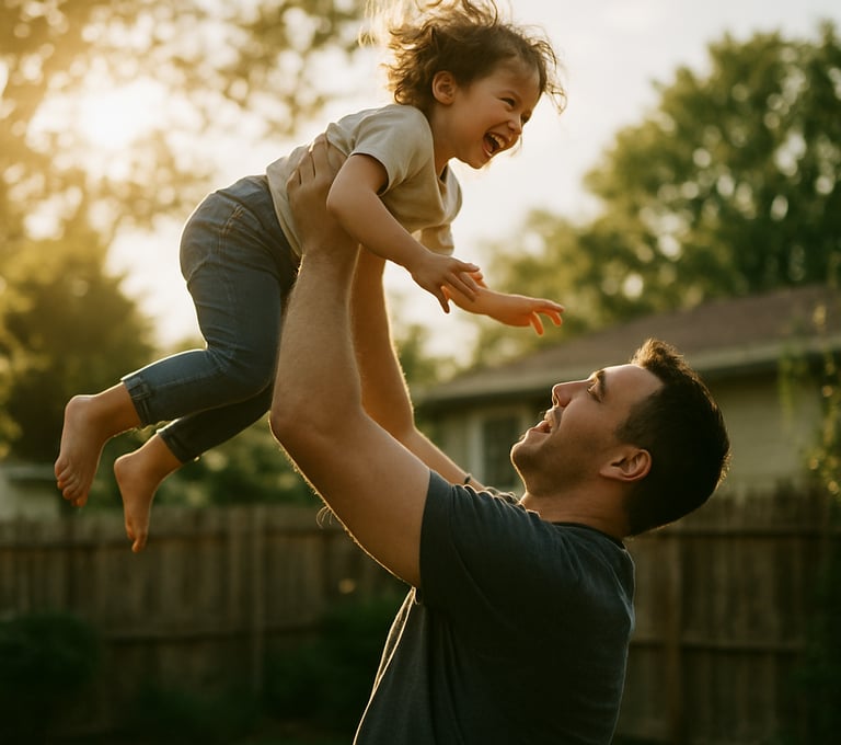 A father playfully lifting his child toward the sky in a North American backyard. The image is candid and full of movement, shot in a cinematic style with warm, sun-drenched highlights.