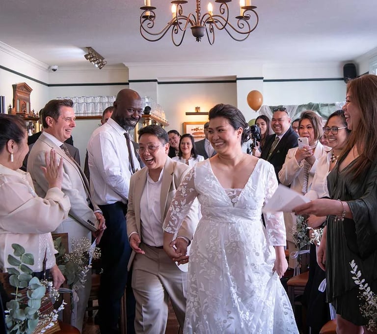 same-sex couple walking into their ceremony at The Admiral Hardy Greenwich