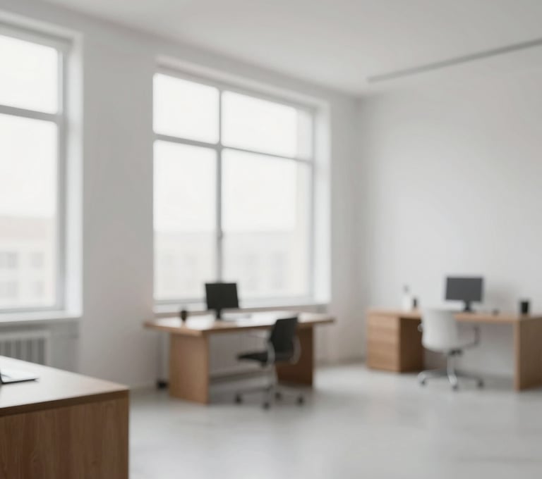 Interior shot of a minimalist design studio with large windows. The palette features #FBF9F6 walls and #6B6760 furniture. Clean, bright, and modern atmosphere representing professional elegance.