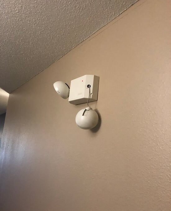 broken emergency light on wall