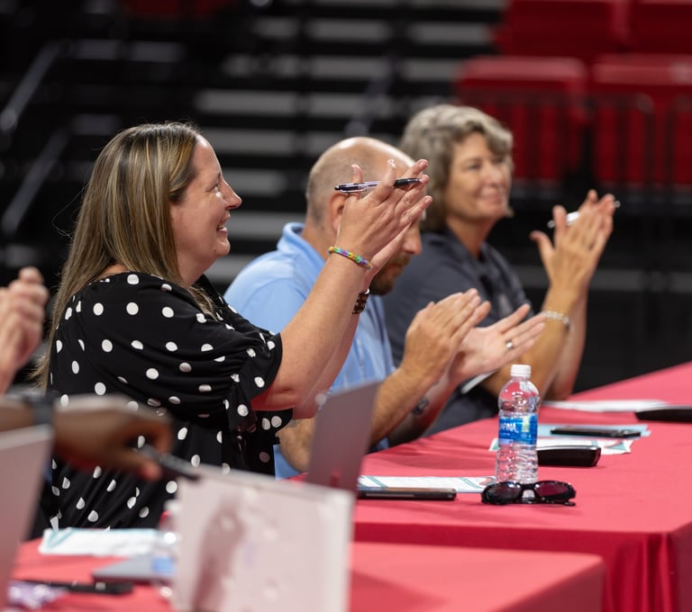 judges applaud students after a main stage presentation