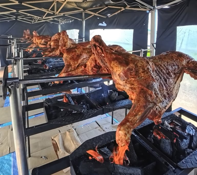 a bunch of meat on a grill with meat on it