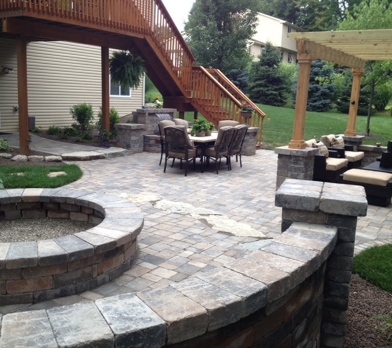 Leppek Landscapes designed patio, gazebo, water feature, fire pit and walkways. 