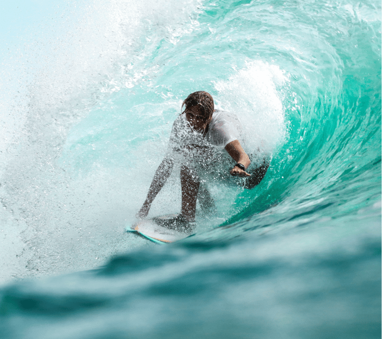 a person riding a surfboard in the ocean
