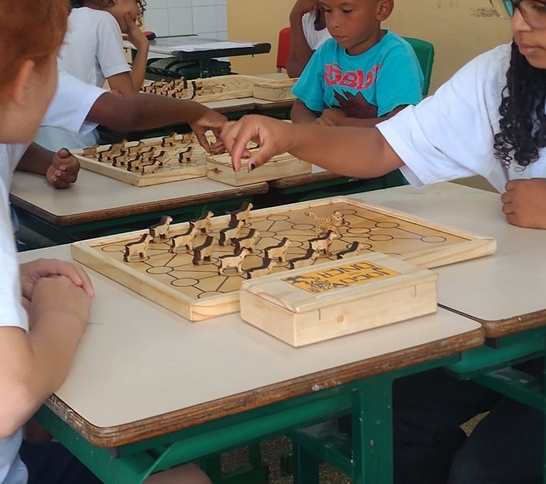 a group of children playing chess in a classroom