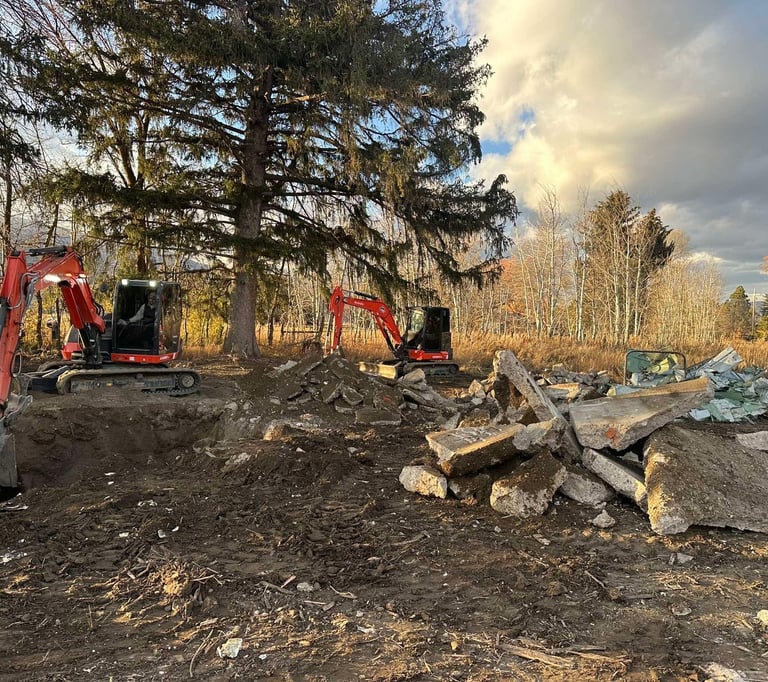 Kubota excavators digging up concrete
