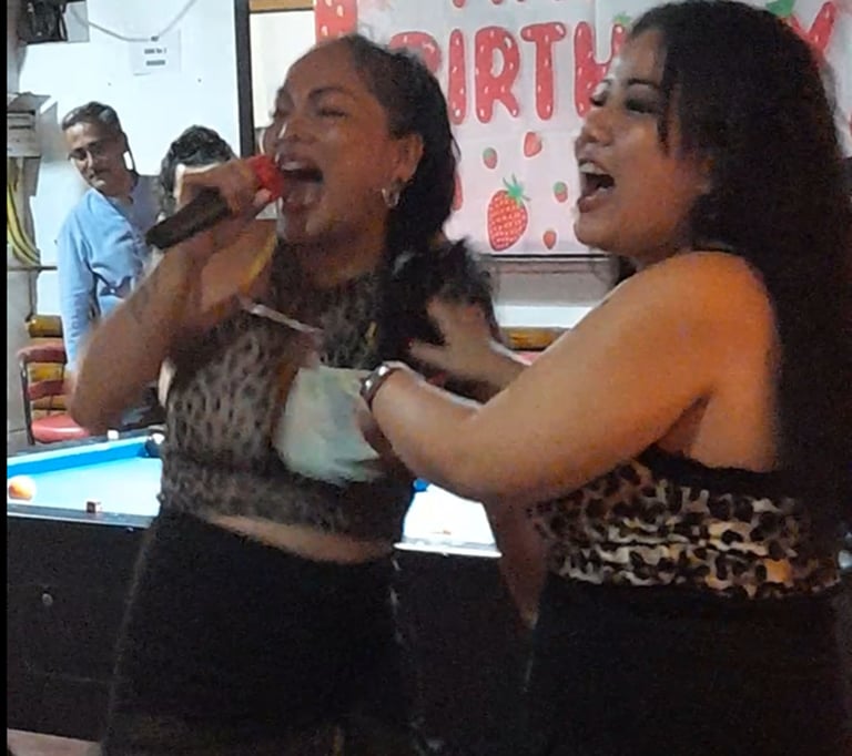 Thai women singing and dancing at bar on Soi 94, Hua Hin