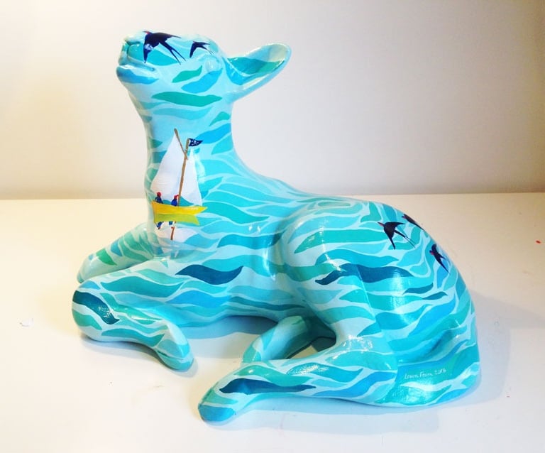 Small sculpture of a lamb featuring a Swallows and Amazons design by Laura Fearn