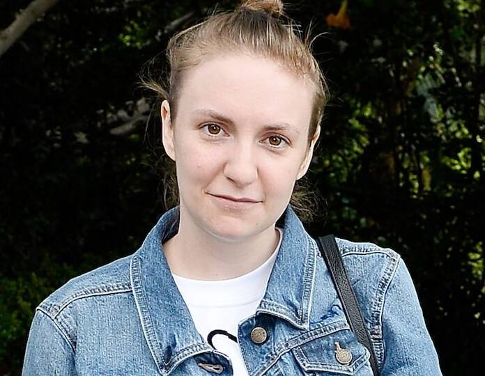 a woman in a denim jacket and jeans jacket