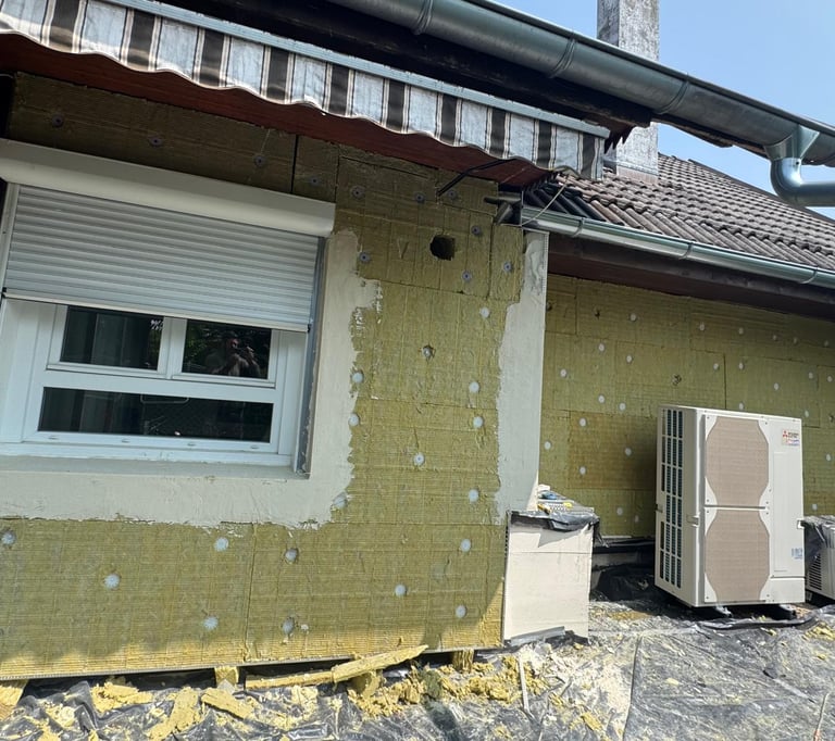 a refrigerator freezer sitting on top of a roof
