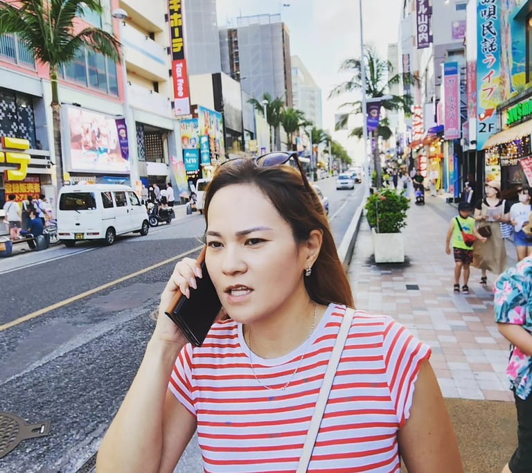 a Japanese woman talking on her cell phone