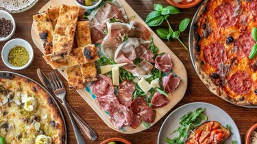 Italian pizzas and antipasto from a cosy neighbourhood restaurant close to Marche Home Stay.