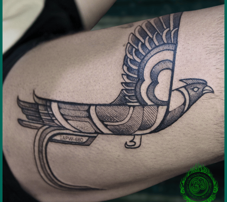 Linework tattoo of a custom bird on the thigh