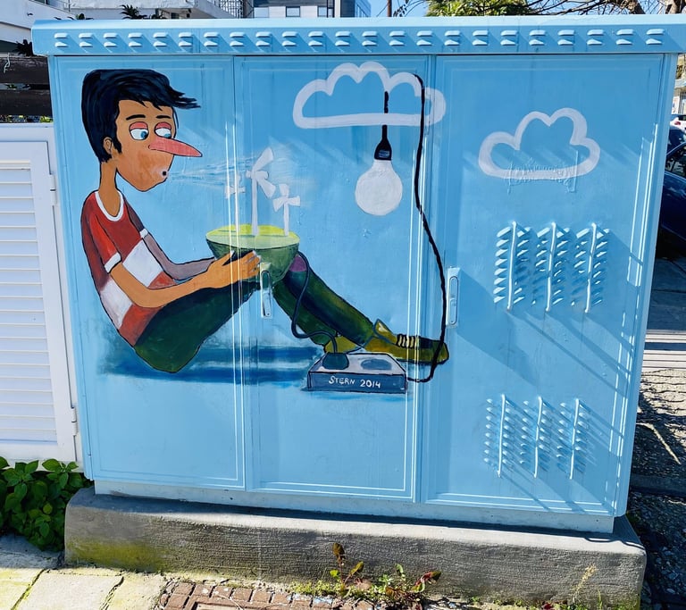a blue box with a cartoon character painting on it in Rhodes Greece street art