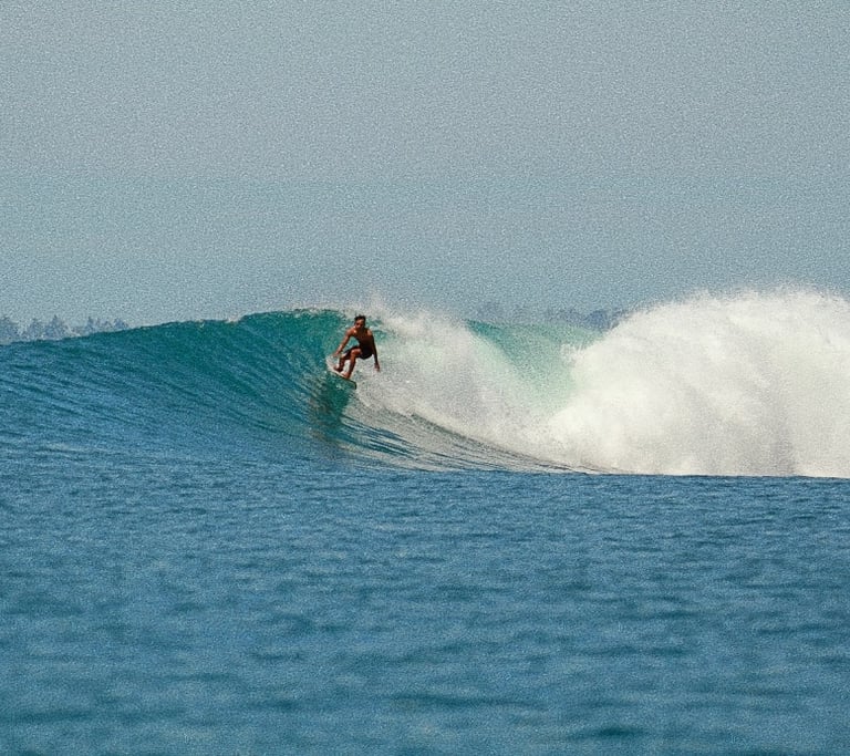 a local man surfing in mentawai