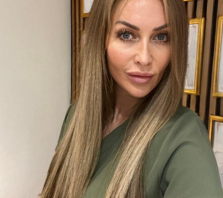 a woman with long hair and a green dress