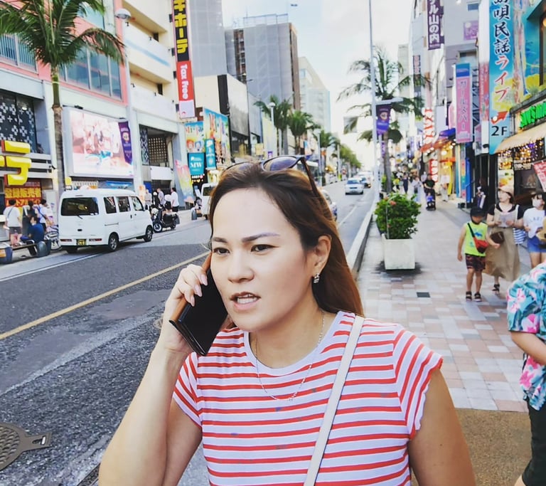 a Japanese woman talking on her cell phone