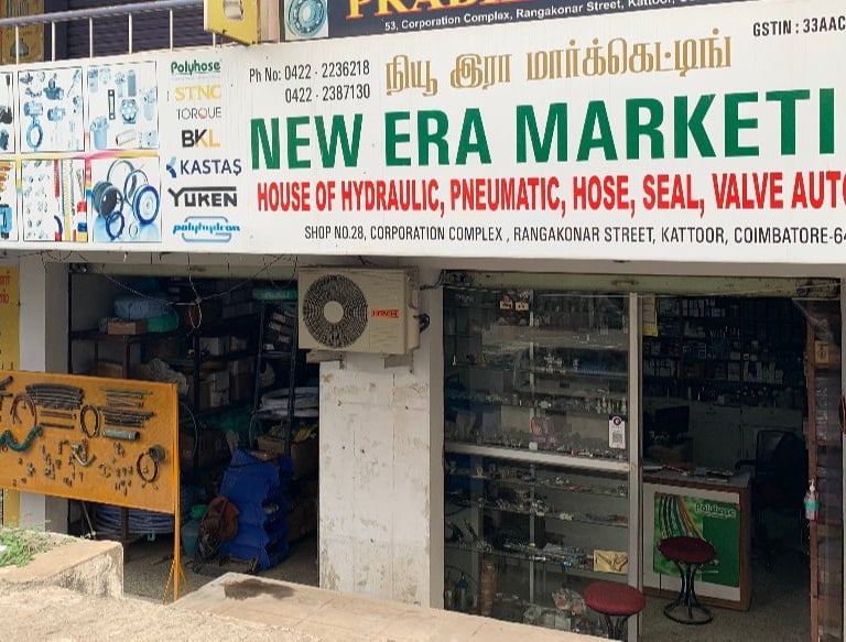 Shop outside photo of New Era Marketing. Main road facing shop in Rangakonar street, Kattoor