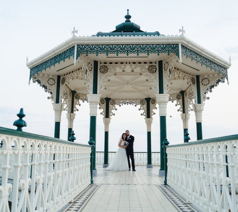 Bride and groom wedding photoshoot at Brighton Bandstand, Brighton Beach