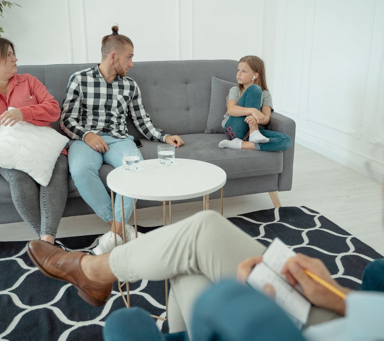 Homeopath is observing the behaviour of patient with family while taking cade history