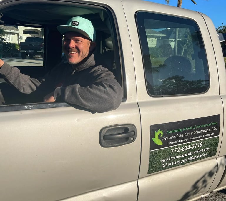 Owner of Treasure Coast lawn care company in Sebastian FL driving truck