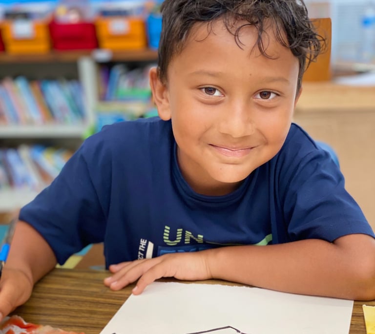 child drawing on watercolor paper