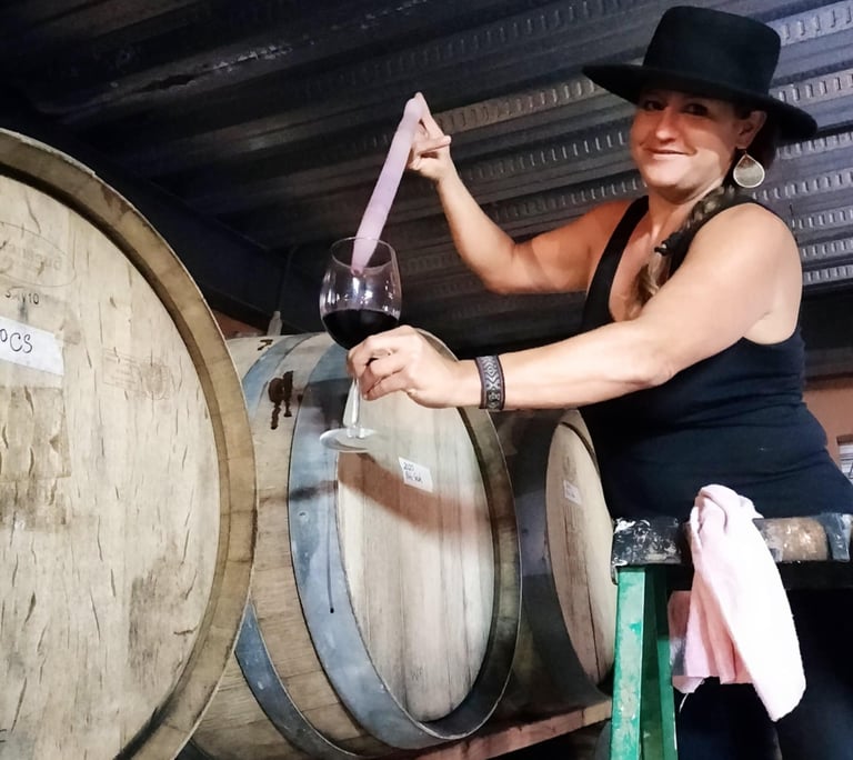 Kate taking a barrel sample at Valle Girl Vino