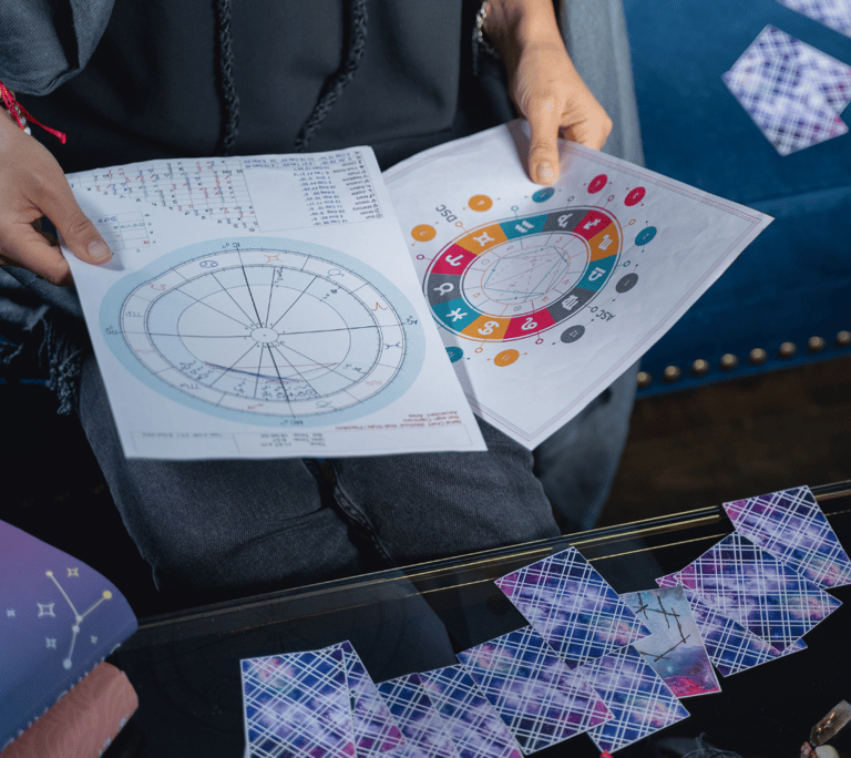 a person holding a piece of paper with a circle of numbers on it