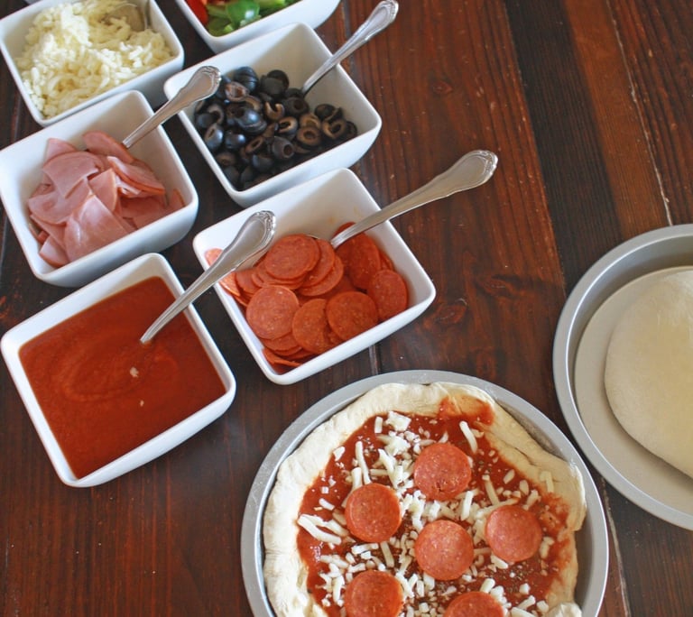 a pizza pie with pepperoni for build your own pizza catering parties