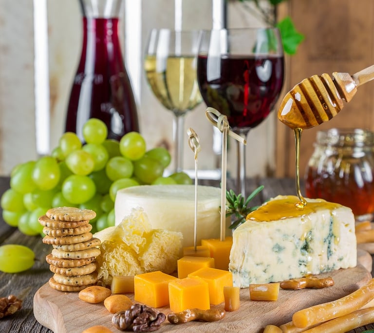 Selección de quesos y vinos premium.