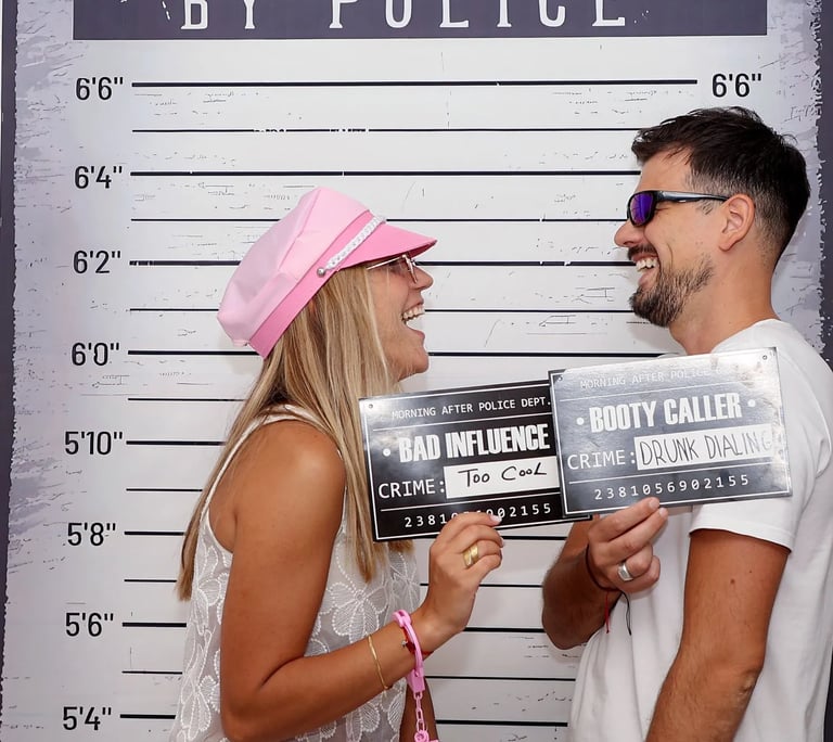 Friends posing with police mugshot boards Selfie Experience Split interactive museum.