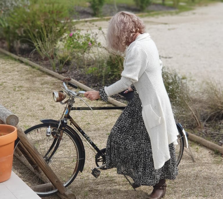 A woman with a vintage bicycle photo