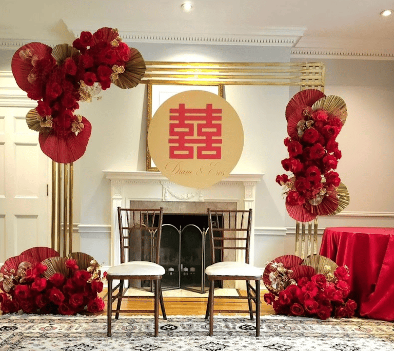 Chinese Tea Ceremony gold chrome backdrop with red roses and a double happiness sign for rent
