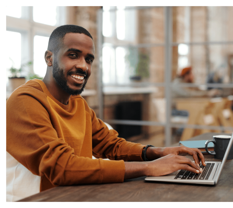 Expert Writer working on laptop