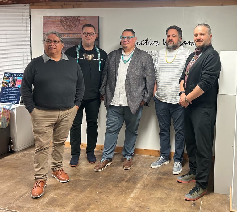 a group of men standing in front of art