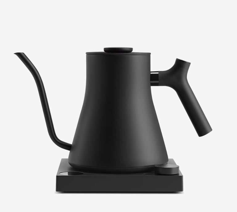 Matte black electric gooseneck kettle with precision pour spout on a matching minimalist base.
