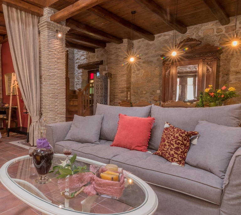 Spacious living area with three seats sofa and coffee table in Villa Galanoussa