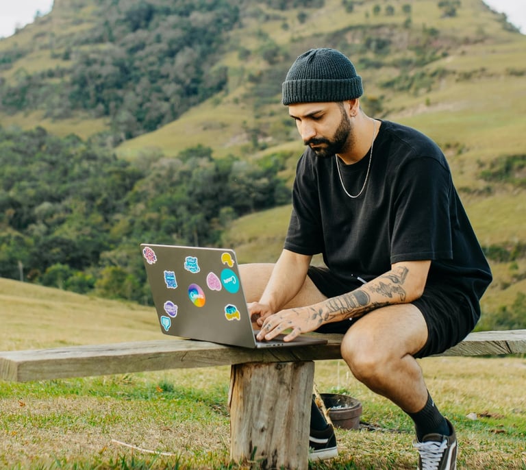 man sitting outdoors working
