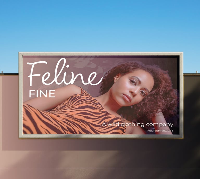 Outdoor billboard advertisement for Feline Fine showcasing modern fashion branding.