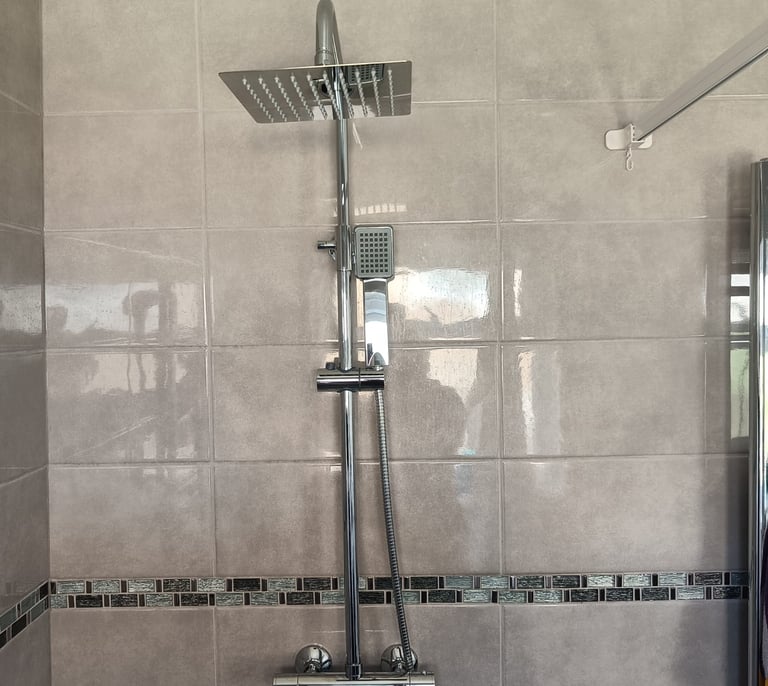 Emergency plumber fixing a burst water pipe and preventing water damage