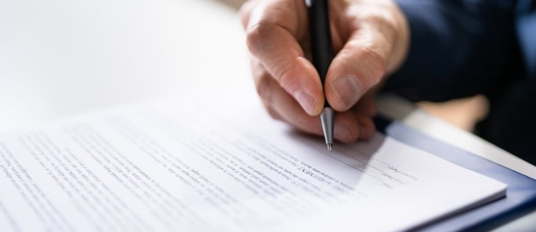 lawyer signing a document