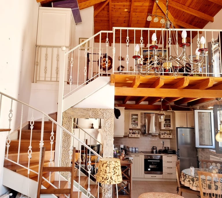 a staircase leading to a kitchen and living room